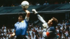 Diego Maradona tickles the ball over the head of England’s Peter Shilton to give Argentina a 1-0 lead at the Azteca Stadium.