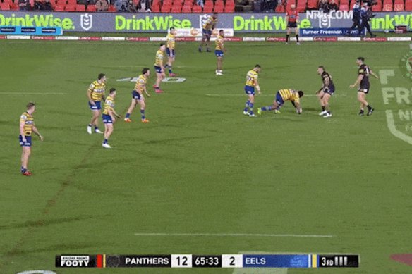 Warren Ryan wants to see less of this: Mitchell Moses turns his back to the defence while passing to Shaun Lane.