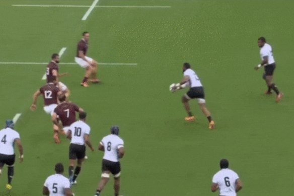 The tackler does not completely release the player.