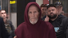 A magistrate believes a 78-year-old former rugby league international could abscond if granted bail while accused of a violent armed robbery three decades ago.