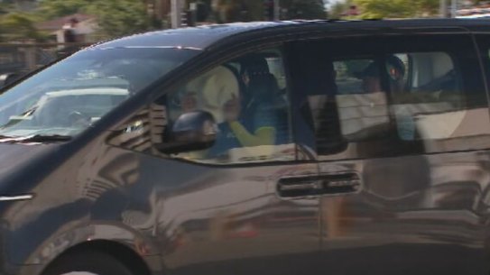 Josh Hazlewood and Mitchell Starc leave the Gabba in a car during Australia’s main training session. 