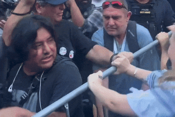 Police and protesters clash.