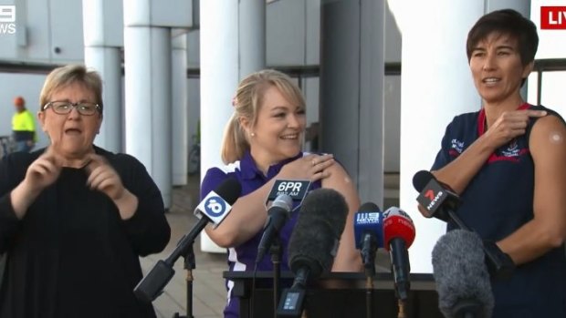 WA hotel quarantine workers Antonia Garza (right) and Keita Winks were the first in the state to receive the COVID-19 vaccine.