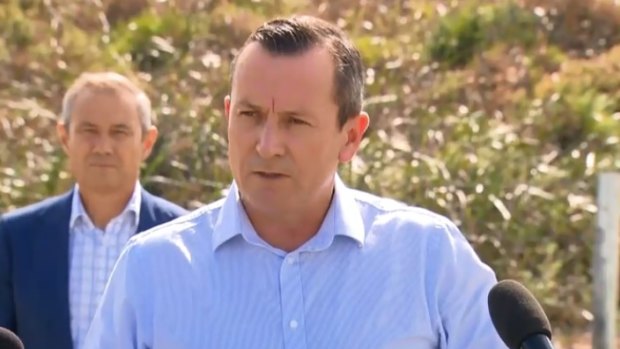 WA Premier Mark McGowan and Health Minister Roger Cook (background).