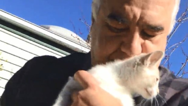 Video stills of Con and Liudmilla Petropoulos allegedly selling kittens in a park at Flemington.