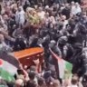 Israeli forces beat pallbearers at funeral of Al Jazeera journalist.