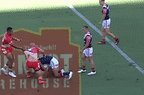 Felise Kaufusi rattles Brandon Smith’s cage in the Dolphins’ first game against the Sydney Roosters.