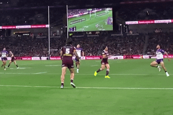 Kotoni Staggs blatantly interferes with Xavier Coates as he attempts to get to the ball last Thursday night in Brisbane.