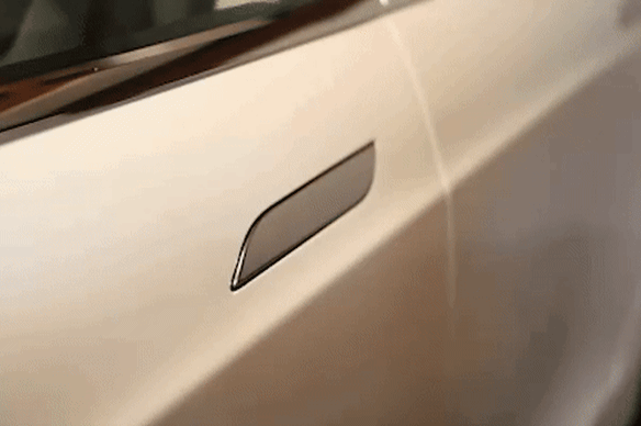 A hidden door handle on a Tesla.