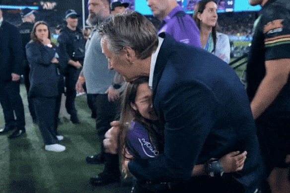 Craig Bellamy consoles his granddaughter Billie after last year’s grand final loss.
