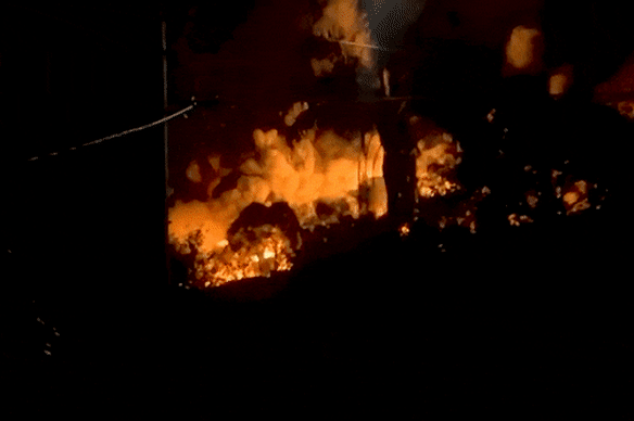An oil drum storage facility in Brisbane’s east burst into flames overnight, throwing fireballs and billows of smoke into the air.