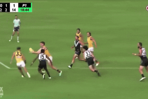 Sam Powell-Pepper collides with Adelaide’s Mark Keane, who was concussed in the incident.