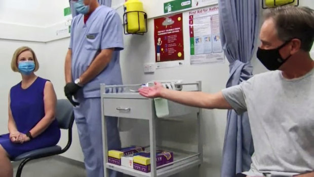 Former prime minister Julia Gillard and federal Health Minister Greg Hunt before receiving their COVID-19 vaccinations on Sunday. 