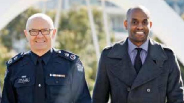 Mohamed Saleh (right) in 2014 with the then Chief Commissioner of Police, Ken Lay.