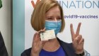 Former Prime Minister Julia Gillard receives a COVID-19 vaccination.