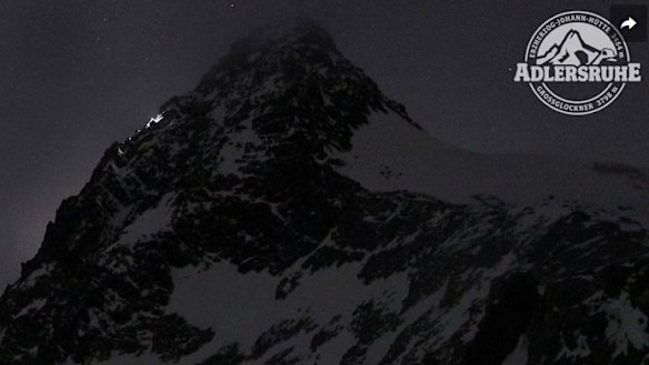 Haunting webcam images show the couple’s torches near the summit. Subsequent footage shows just one light continuing alone.