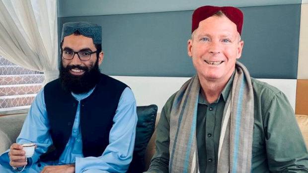 Anas Haqqani and Timothy Weeks meet in the airport in Doha, Qatar.