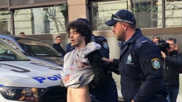 Mert Ney is arrested after being detained by members of the public on Tuesday. 