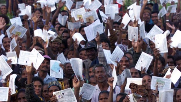 Huge crowds of East Timorese defied threats of violence to flock to polling stations, dressed in their Sunday best, clutching their identification papers.