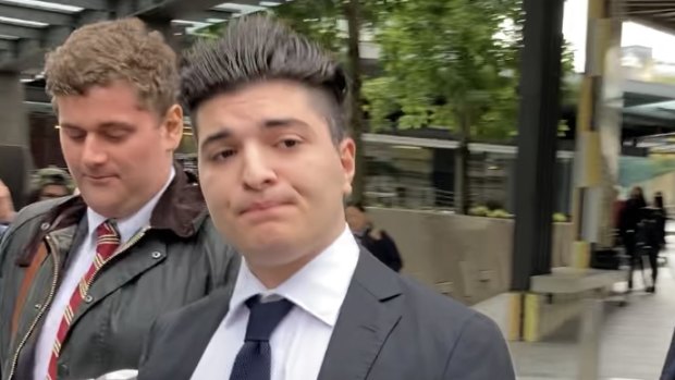 Suspended UQ student Drew Pavlou leaves Brisbane Magistrates Court last month after a hearing in the case he has brought against Brisbane's Chinese Consular-General Xu Jie. 