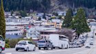 Vehicles along a road in Queenstown. EV sales are up, prompting government reforms.