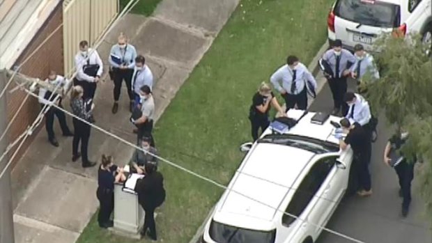 Police outside the Tullamarine property on Thursday afternoon. 