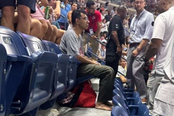 A protester glued his feet to the ground at Arthur Ashe Stadium.