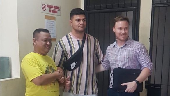 David Fifita (centre) with alleged assault victim Dani Irawan and Broncos staff member Adam Walsh.