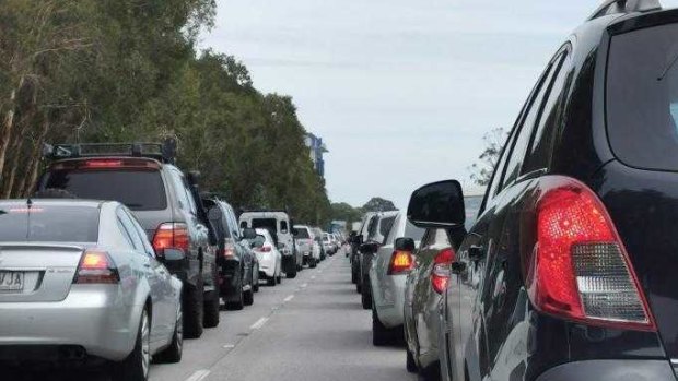 Traffic is built up on the Queensland/NSW border on Monday.