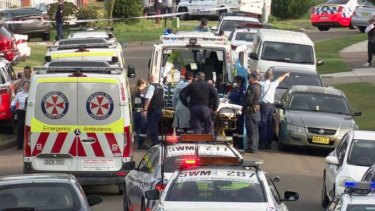 Emergency services outside a home on Lakewood Crescent in Casula where two toddlers were discovered unresponsive in a backyard pool.
