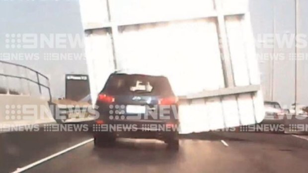 The moment the sign fell was caught on dashcam footage.