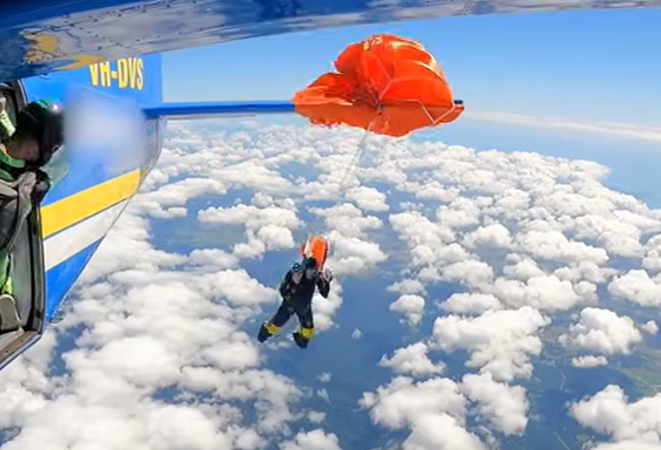 Skydiver dangles from plane tail after parachute snags