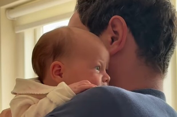 Princess Eugenie shares rare royal baby video to celebrate wedding anniversary, showing husband Jack Brooksbank cradling their newborn daughter, Adelaide.