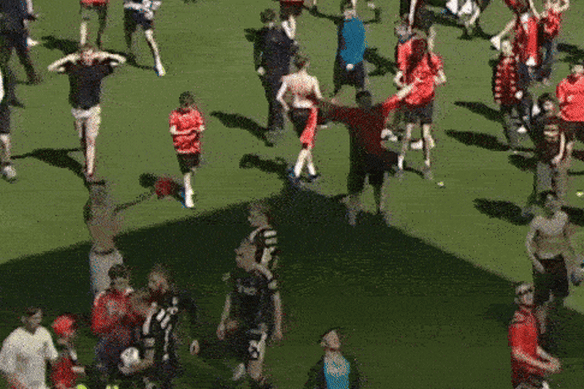 Aberdeen player Jack Mackenzie is hit by a seat thrown by one of his own supporters