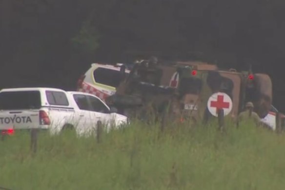 Emergency vehicles help the injured soldiers.
