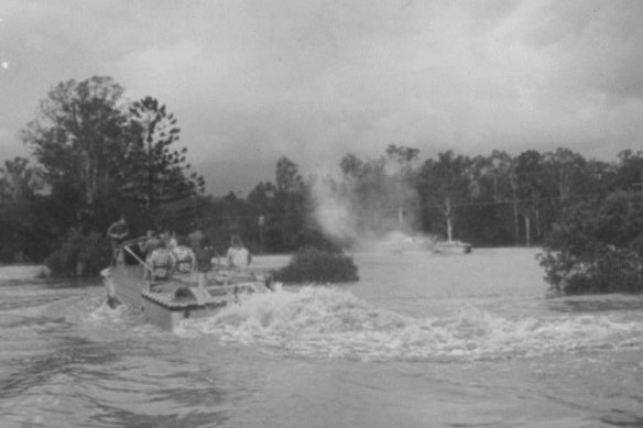 An explosion starts after electricity arcs from power lines at Bellbowrie to the metal tip of a boat hook held by army reservist Captain Ian Kerr, army inquest notes show.