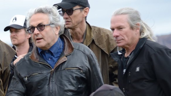 Guy Norris (right) with director George Miller when they filmed the climactic truck roll at the end of Mad Max: Fury Road at Penrith Lakes, NSW.