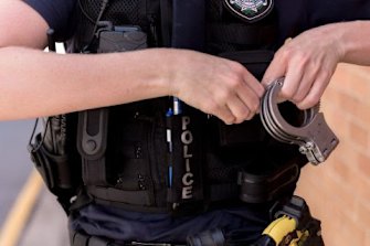 A police officer accused of raping a woman in 1999 has been suspended from duty. 
