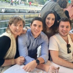 Proud family man: Mitchell Moses with mother Rhonda, sister Katherine and brother Stephen.