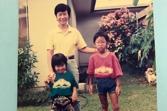 Cheng with her mother and brother Christopher in the backyard of the Cairns housing commission home where she grew up.