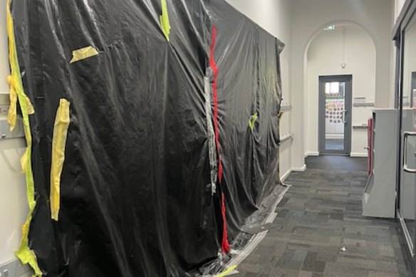 Plastic covering damage in a classroom at Fitzroy North Primary School. The plastic has been there – and the classroom closed – for more than a year.