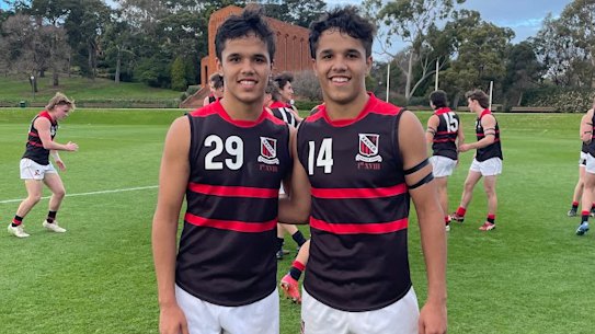 Jayden Davey (left) and twin brother Alwyn jnr in their Xavier College jumpers at Scotch College.