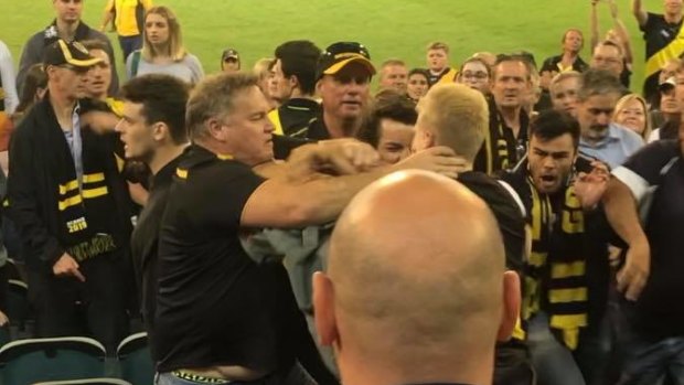 Footage shows a group of men involved in the brawl, while the Tigers club song plays in the background.