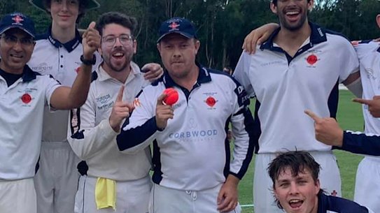 The Mudgeeraba team celebrate Gareth Morgan’s (with ball) remarkable feat.