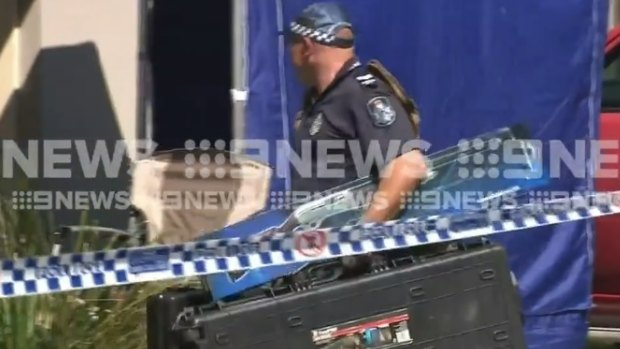 Footage from the Crestmead home where the QPS employee was shot showed officers seizing numerous firearms.