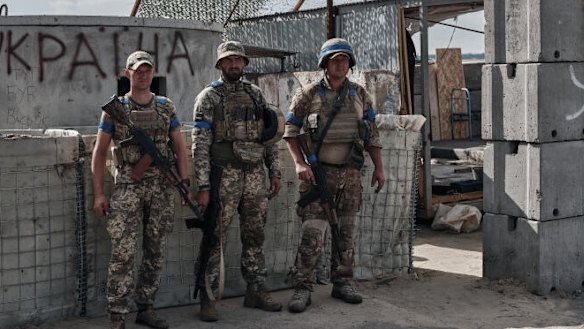 Ukrainian military personnel man a checkpoint on Russian territory in Sudzha, Russia.