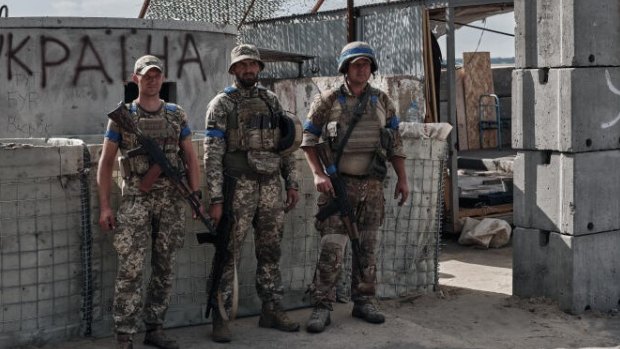 Ukrainian military personnel man a checkpoint on Russian territory in Sudzha, Russia.