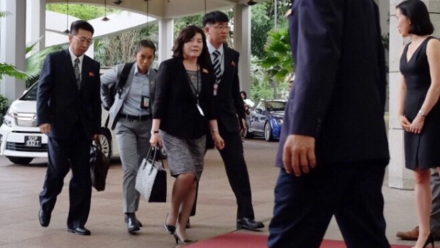 North Korean vice minister of foreign affairs Choi Sun-hee (third from left) arrives at the Ritz Carlton Hotel in Singapore to continue talks with the American ambassador to the Philippines, Sung Kim. 