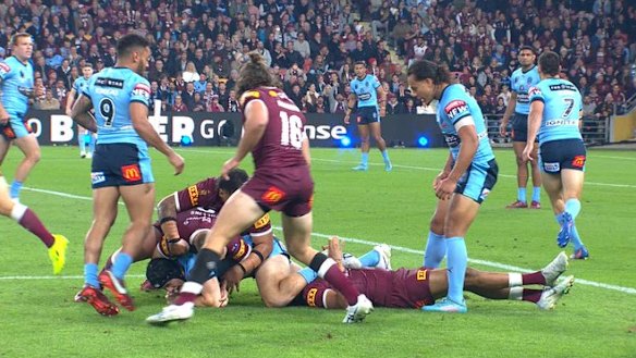 Luai stands over a concussed Selwyn Cobbo during Origjn III last year at Suncorp Stadium.