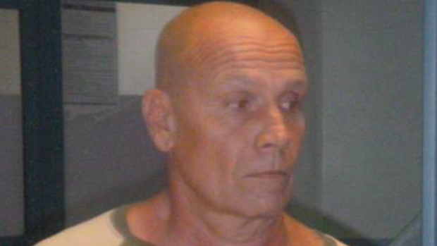 Queensland police are searching for Alan Lace, who is connected to the death of police dog Rambo in Maryborough.